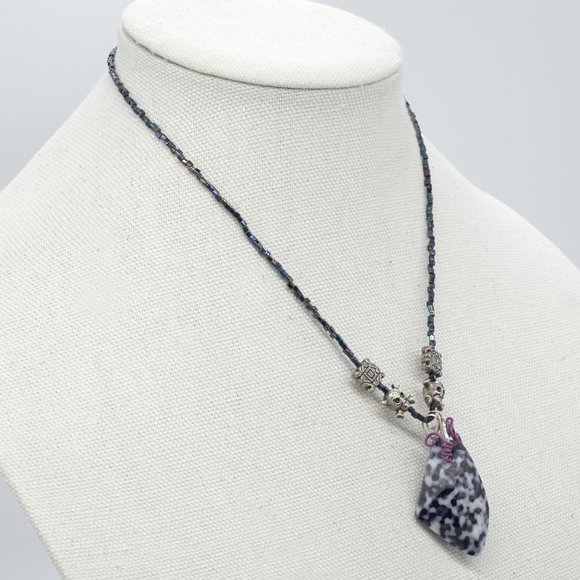 Necklace with assorted charms and stone. - Picture 2 of 5